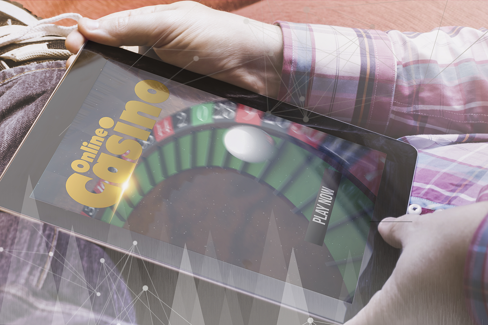 Casino gaming evolution – player exploring slots development, skill-based games, and iGaming trends 2025 on a tablet for omnichannel casino experiences.